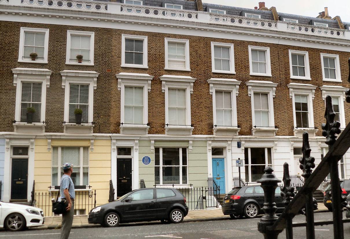 Image may contain: house, tree, car and outdoor