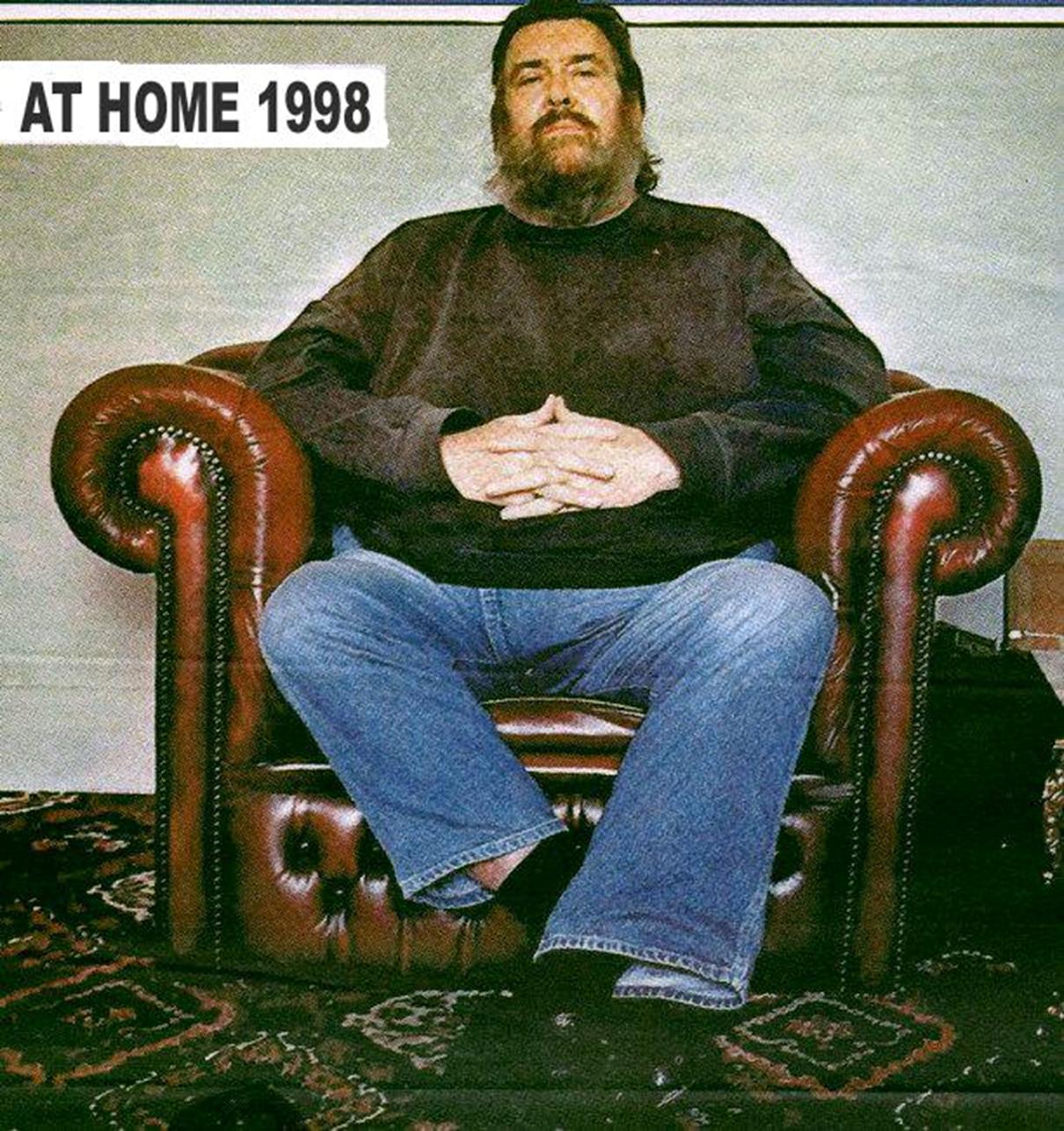 Image may contain: 1 person, sitting and beard, possible text that says 'AT HOME 1998'